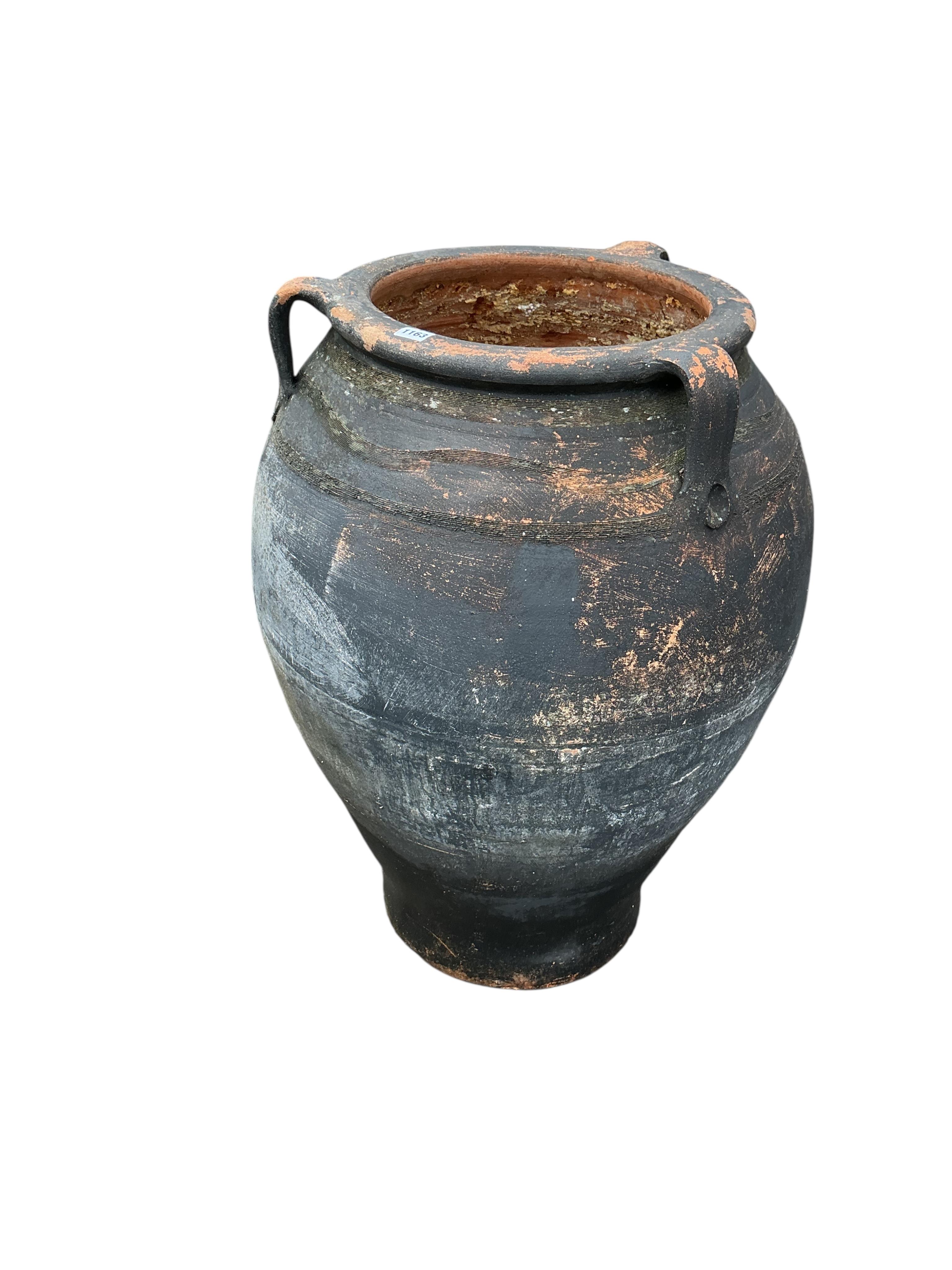 A Greek style painted terracotta oil jar, height 84cm